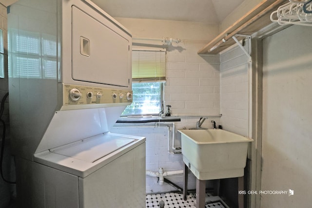 143 Eagle Point Rd, Fox Lake, IL 60020 - laundry area featuring stacked washer / drying machine and concrete block wall