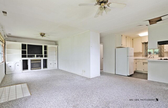 143 Eagle Point Rd, Fox Lake, IL 60020 - unfurnished living room with ceiling fan and a fireplace