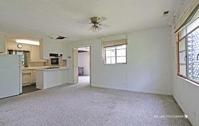 143 Eagle Point Rd, Fox Lake, IL 60020 - kitchen featuring white appliances, a ceiling fan, carpet, light countertops, and tasteful backsplash