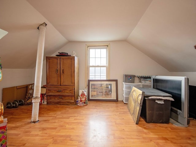 1742 N 34th Ave, Stone Park, IL 60165 - additional living space featuring light wood-style floors, vaulted ceiling, and decorative columns