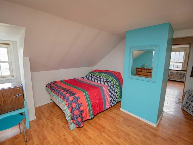 1742 N 34th Ave, Stone Park, IL 60165 - bedroom with multiple windows, wood finished floors, and vaulted ceiling