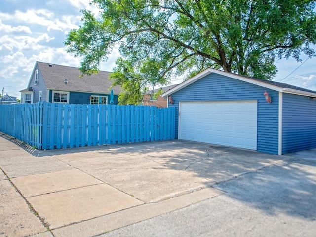 1742 N 34th Ave, Stone Park, IL 60165 - view of property exterior with a detached garage and an outdoor structure