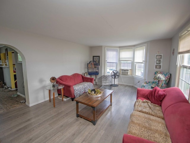 1742 N 34th Ave, Stone Park, IL 60165 - living area with arched walkways, wood finished floors, and cooling unit
