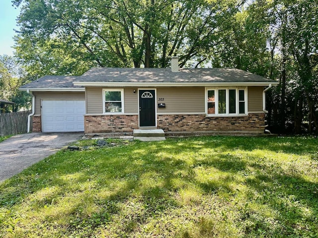 303 Ann St, South Elgin, IL 60177 - view of front of home featuring asphalt driveway, a garage, brick siding, and a chimney
