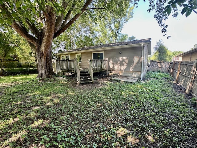 303 Ann St, South Elgin, IL 60177 - back of house featuring a wooden deck and a fenced backyard
