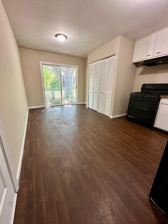 303 Ann St, South Elgin, IL 60177 - unfurnished living room featuring dark wood-style floors and baseboards