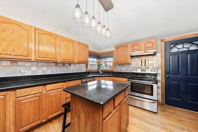 9912 S Kolmar Ave, Oak Lawn, IL 60453 - kitchen featuring electric range, under cabinet range hood, vaulted ceiling, a center island, and light wood-style floors