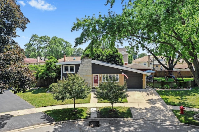 9912 S Kolmar Ave, Oak Lawn, IL 60453 - view of front of property featuring driveway, a garage, a chimney, and stone siding