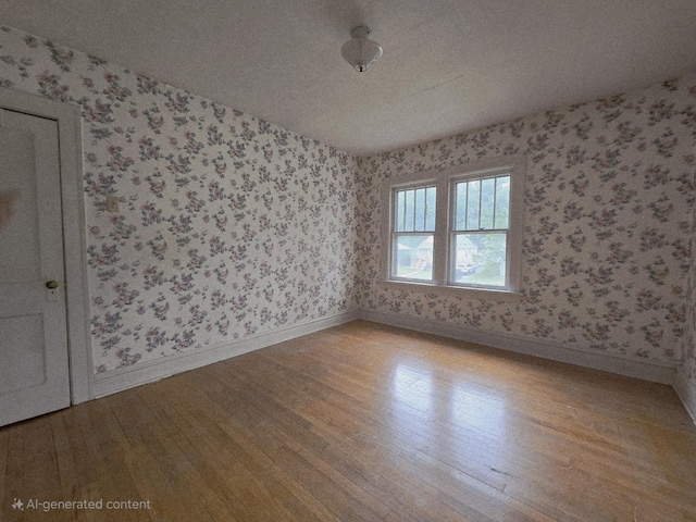 434 S Lewis Ave, Lombard, IL 60148 - spare room featuring wallpapered walls, wood finished floors, and a textured ceiling