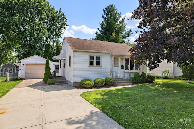 3715 Maple Ave, Mchenry, IL 60050 - view of front of house with an outdoor structure, a garage, and concrete driveway