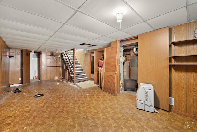 3715 Maple Ave, Mchenry, IL 60050 - finished basement featuring wood walls, stairway, and a drop ceiling