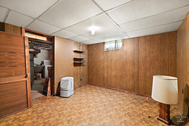 3715 Maple Ave, Mchenry, IL 60050 - basement featuring a paneled ceiling and wooden walls