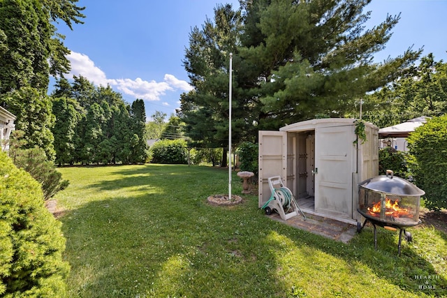 3715 Maple Ave, Mchenry, IL 60050 - view of green lawn featuring a fire pit and a shed
