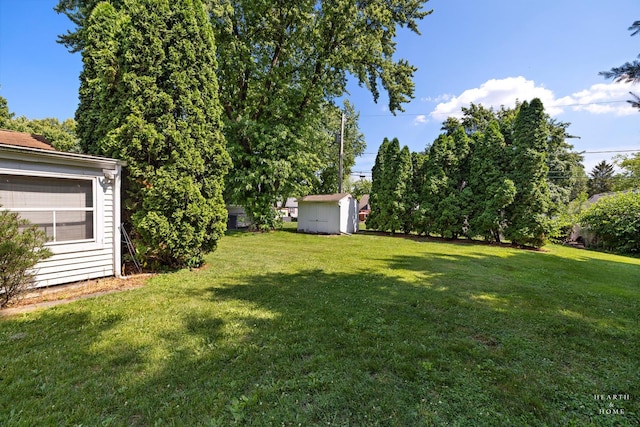3715 Maple Ave, Mchenry, IL 60050 - view of green lawn featuring a storage shed