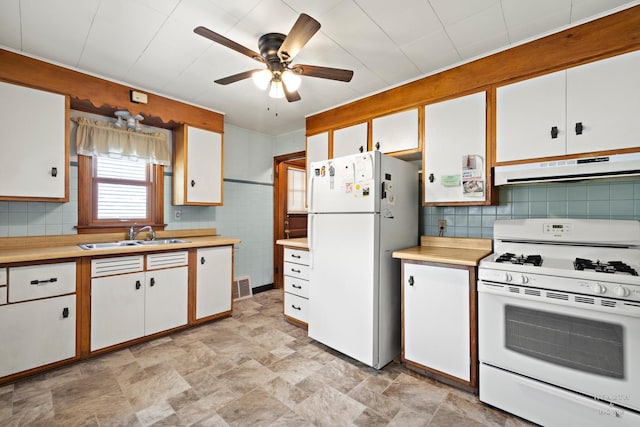 3715 Maple Ave, Mchenry, IL 60050 - kitchen featuring white appliances, under cabinet range hood, light countertops, and a ceiling fan