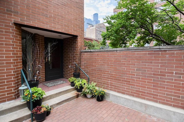 801 S Plymouth Ct Unit V, Chicago, IL 60605 - view of exterior entry featuring a city view and brick siding
