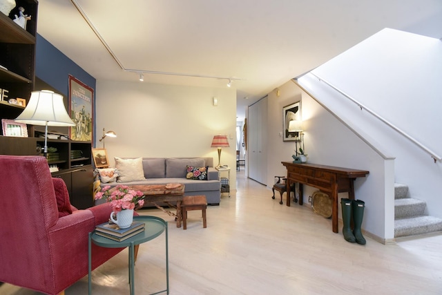 801 S Plymouth Ct Unit V, Chicago, IL 60605 - living room with track lighting, wood finished floors, and stairway
