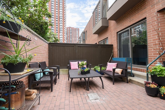 801 S Plymouth Ct Unit V, Chicago, IL 60605 - fenced backyard with an outdoor living space, a patio, and a view of city