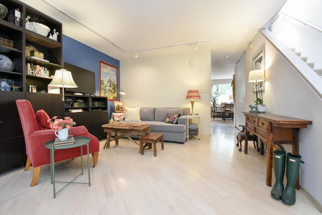 801 S Plymouth Ct Unit V, Chicago, IL 60605 - living area with light wood-style floors, stairs, and track lighting