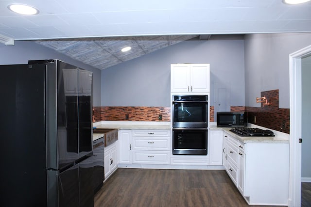 309 Bass St, Wilmington, IL 60481 - kitchen featuring black appliances, dark wood-style flooring, white cabinets, recessed lighting, and lofted ceiling
