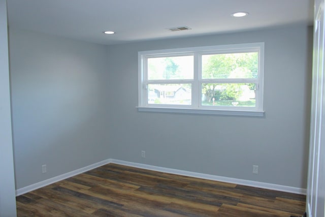 309 Bass St, Wilmington, IL 60481 - empty room featuring dark wood-style floors and recessed lighting
