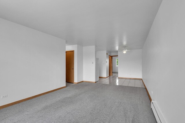 9819 S Cicero Ave Unit 6, Oak Lawn, IL 60453 - empty room featuring baseboard heating, a ceiling fan, and light carpet