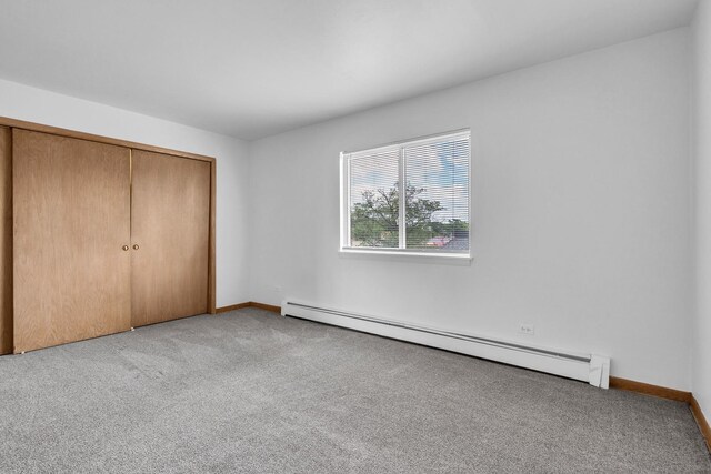 9819 S Cicero Ave Unit 6, Oak Lawn, IL 60453 - unfurnished bedroom featuring a baseboard heating unit, carpet flooring, and a closet