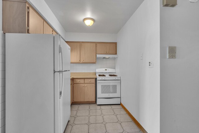 9819 S Cicero Ave Unit 6, Oak Lawn, IL 60453 - kitchen with white appliances, under cabinet range hood, tasteful backsplash, light countertops, and light floors