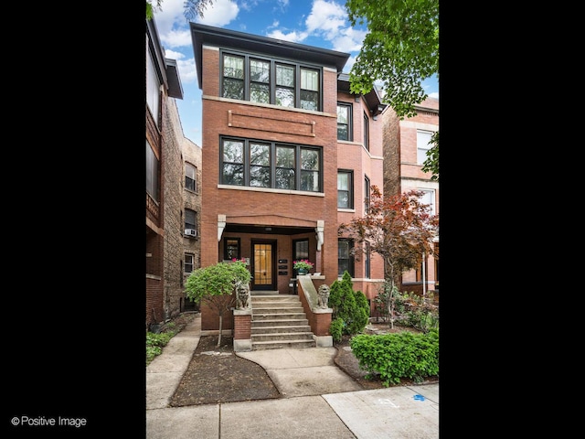 1416 W Olive Ave Unit 1, Chicago, IL 60660 - view of front facade with brick siding and a porch