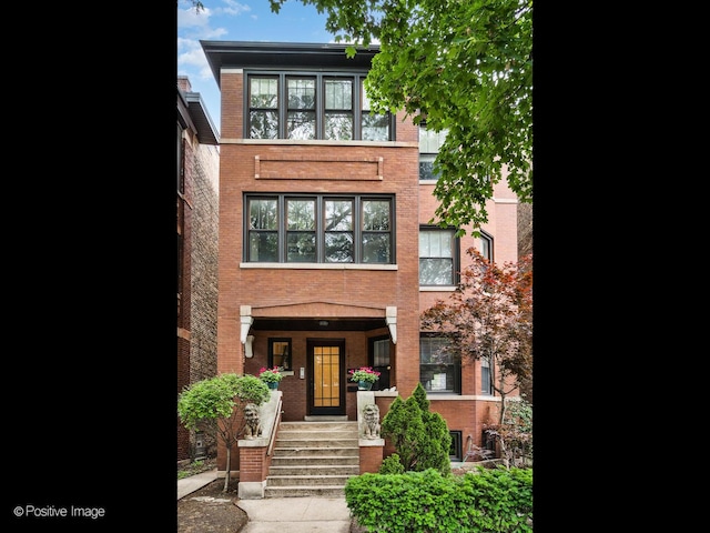 1416 W Olive Ave Unit 1, Chicago, IL 60660 - view of front of home featuring brick siding and covered porch