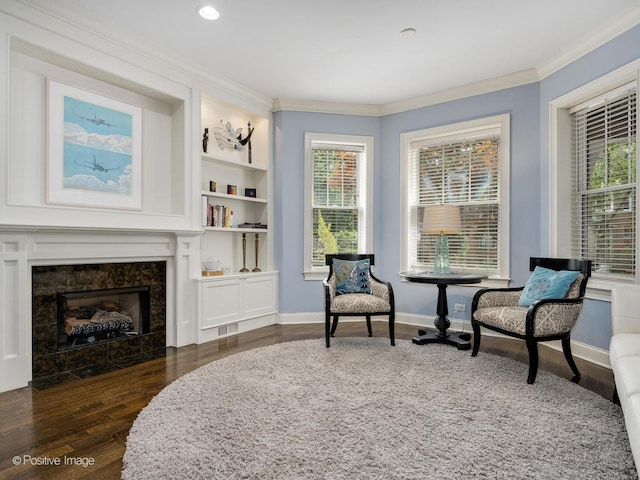 1416 W Olive Ave Unit 1, Chicago, IL 60660 - sitting room featuring ornamental molding, wood finished floors, a premium fireplace, built in shelves, and recessed lighting