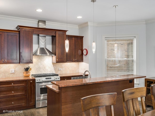1416 W Olive Ave Unit 1, Chicago, IL 60660 - kitchen featuring stainless steel range with gas cooktop, wall chimney exhaust hood, a breakfast bar area, light stone counters, and decorative backsplash