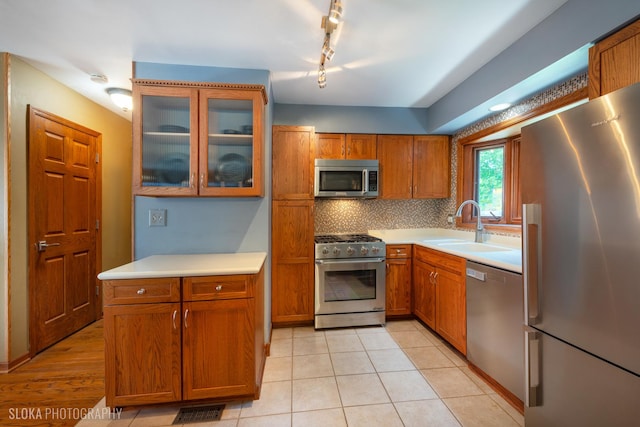 530 Sunnyside Ave, Gurnee, IL 60031 - kitchen featuring appliances with stainless steel finishes, brown cabinetry, and light countertops