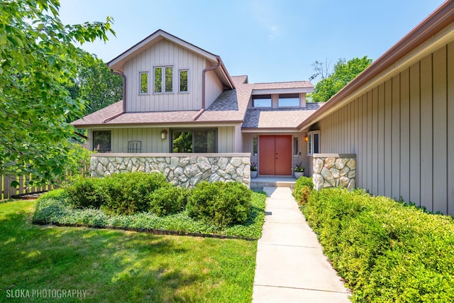 530 Sunnyside Ave, Gurnee, IL 60031 - view of front of property featuring a shingled roof, stone siding, and a front lawn