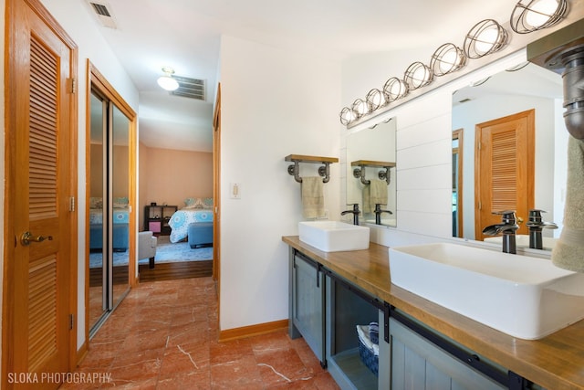 530 Sunnyside Ave, Gurnee, IL 60031 - ensuite bathroom featuring double vanity and a closet