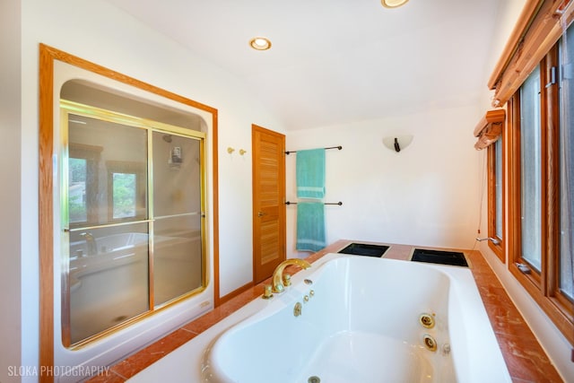 530 Sunnyside Ave, Gurnee, IL 60031 - full bathroom featuring lofted ceiling, a tub with jets, a stall shower, and recessed lighting