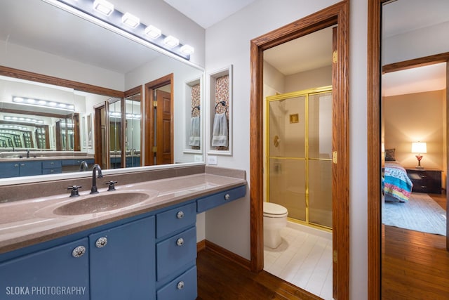 530 Sunnyside Ave, Gurnee, IL 60031 - ensuite bathroom featuring a stall shower, hardwood / wood-style floors, and vanity
