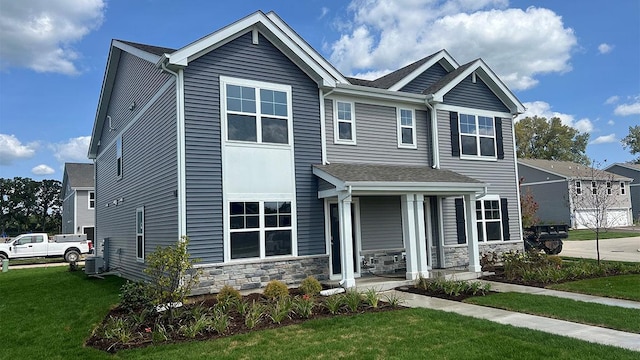 1110 58th Rd Unit 0015, Union Grove, WI 53182 - view of front of home with a front lawn, covered porch, and stone siding