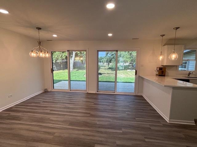 20031 Scott St, Mokena, IL 60448 - unfurnished dining area with dark wood finished floors, recessed lighting, and a chandelier