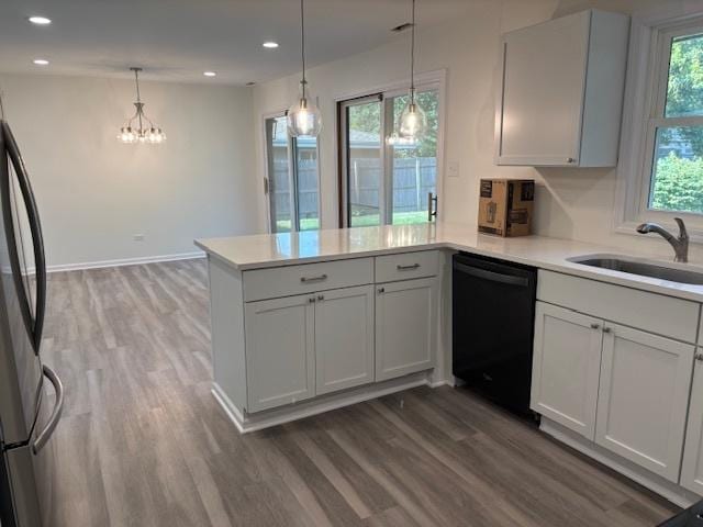 20031 Scott St, Mokena, IL 60448 - kitchen featuring dishwasher, a peninsula, wood finished floors, light countertops, and recessed lighting