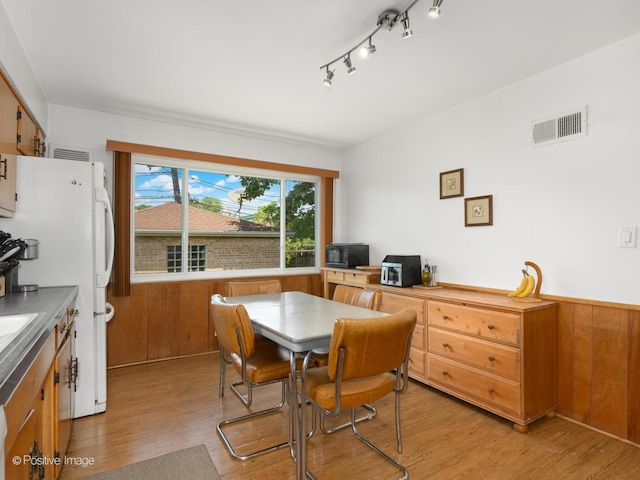 3318 Wilder St, Skokie, IL 60076 - dining space with light wood-style flooring and track lighting