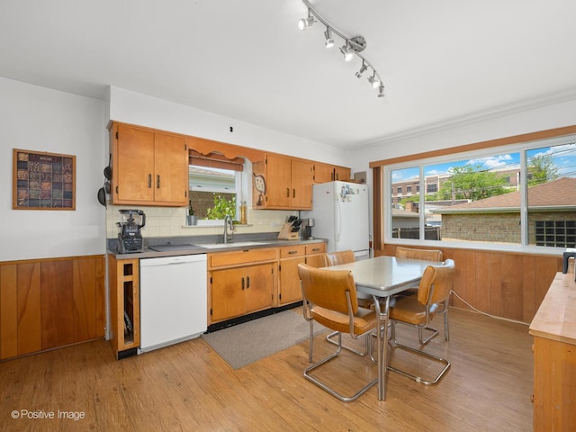 3318 Wilder St, Skokie, IL 60076 - kitchen featuring white appliances, light wood-style floors, plenty of natural light, and decorative backsplash