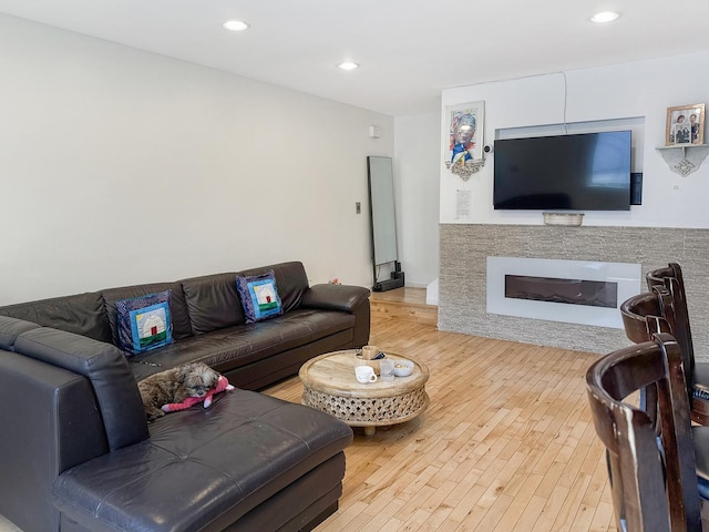 204 Inverrary Ln, Deerfield, IL 60015 - living area with wood finished floors, a glass covered fireplace, and recessed lighting