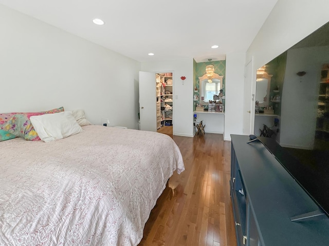 204 Inverrary Ln, Deerfield, IL 60015 - bedroom featuring wood finished floors, a spacious closet, recessed lighting, and a closet