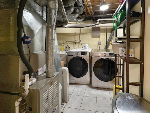 204 Inverrary Ln, Deerfield, IL 60015 - laundry room featuring washer and clothes dryer, heating unit, and marble finish floors