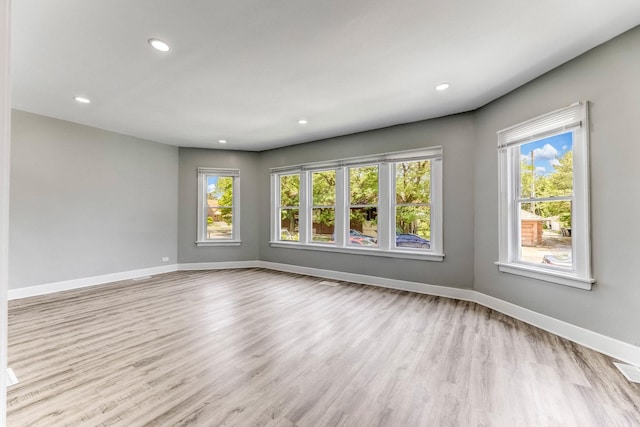 8510 S Blackstone Ave, Chicago, IL 60619 - empty room with light wood-style floors and recessed lighting