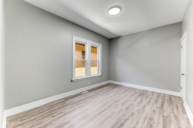 8510 S Blackstone Ave, Chicago, IL 60619 - unfurnished room featuring wood finished floors and baseboards