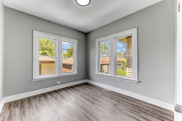 8510 S Blackstone Ave, Chicago, IL 60619 - unfurnished room with baseboards and wood finished floors