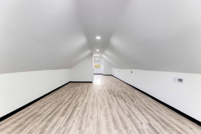 8510 S Blackstone Ave, Chicago, IL 60619 - bonus room featuring vaulted ceiling, wood finished floors, and recessed lighting
