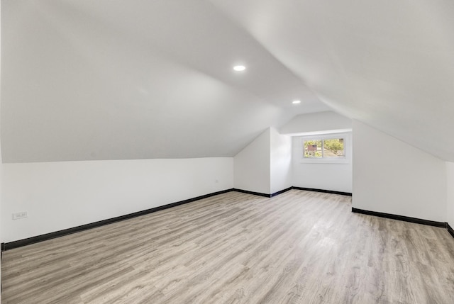 8510 S Blackstone Ave, Chicago, IL 60619 - bonus room featuring wood finished floors, lofted ceiling, and recessed lighting